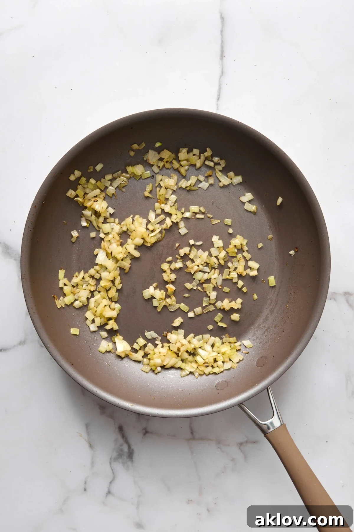 Finely chopped onions sautéing until tender and translucent in the nonstick skillet.