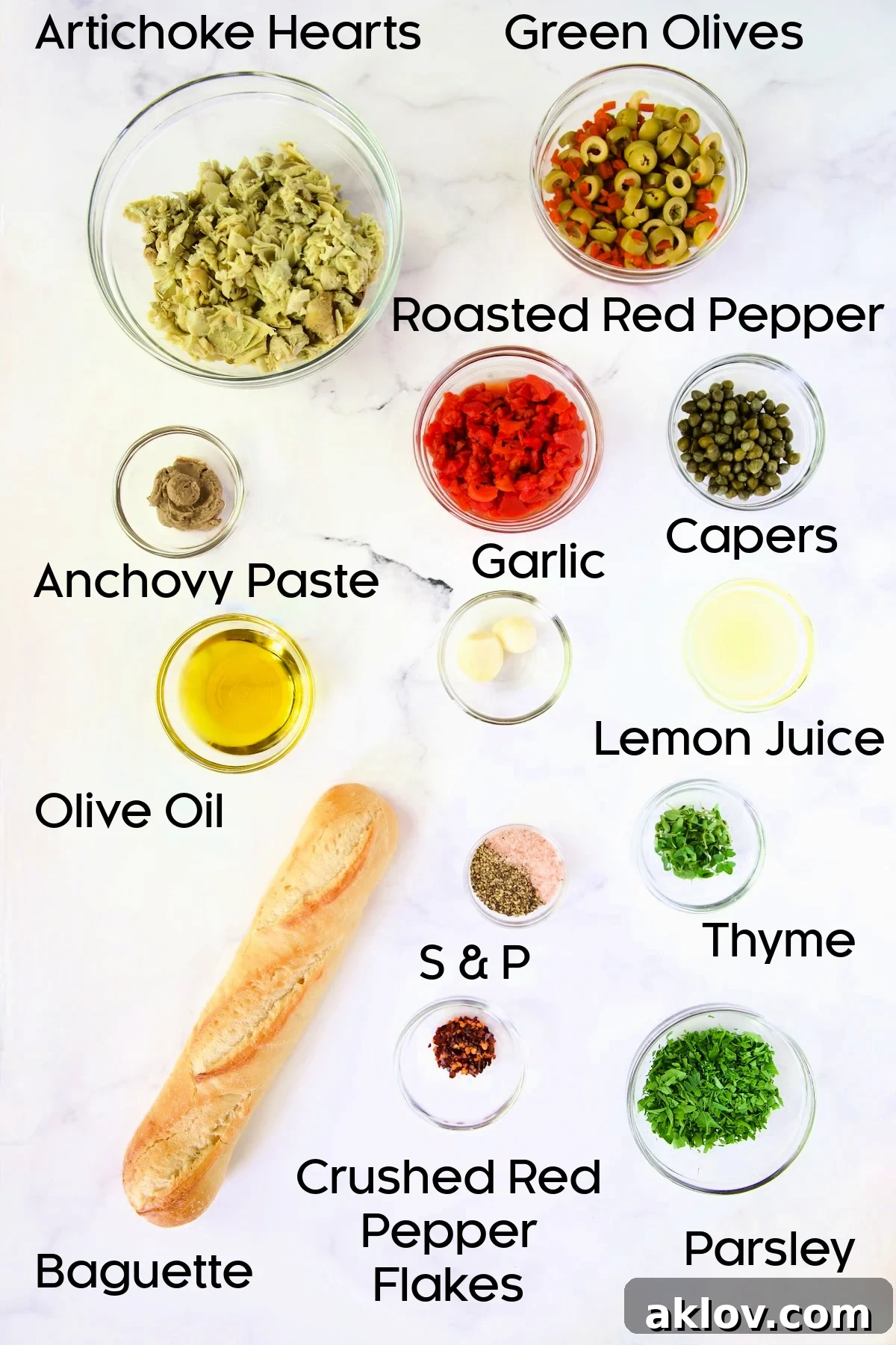 A selection of fresh ingredients for Artichoke Tapenade, including artichoke hearts, olives, and red peppers, arranged in glass bowls.
