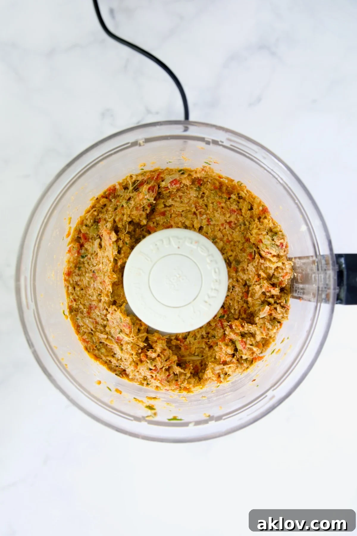 Smooth Artichoke Tapenade in a food processor bowl after blending.