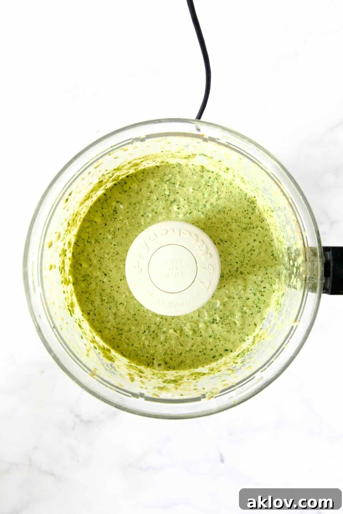 Yogurt marinade in food processor after being pureed.