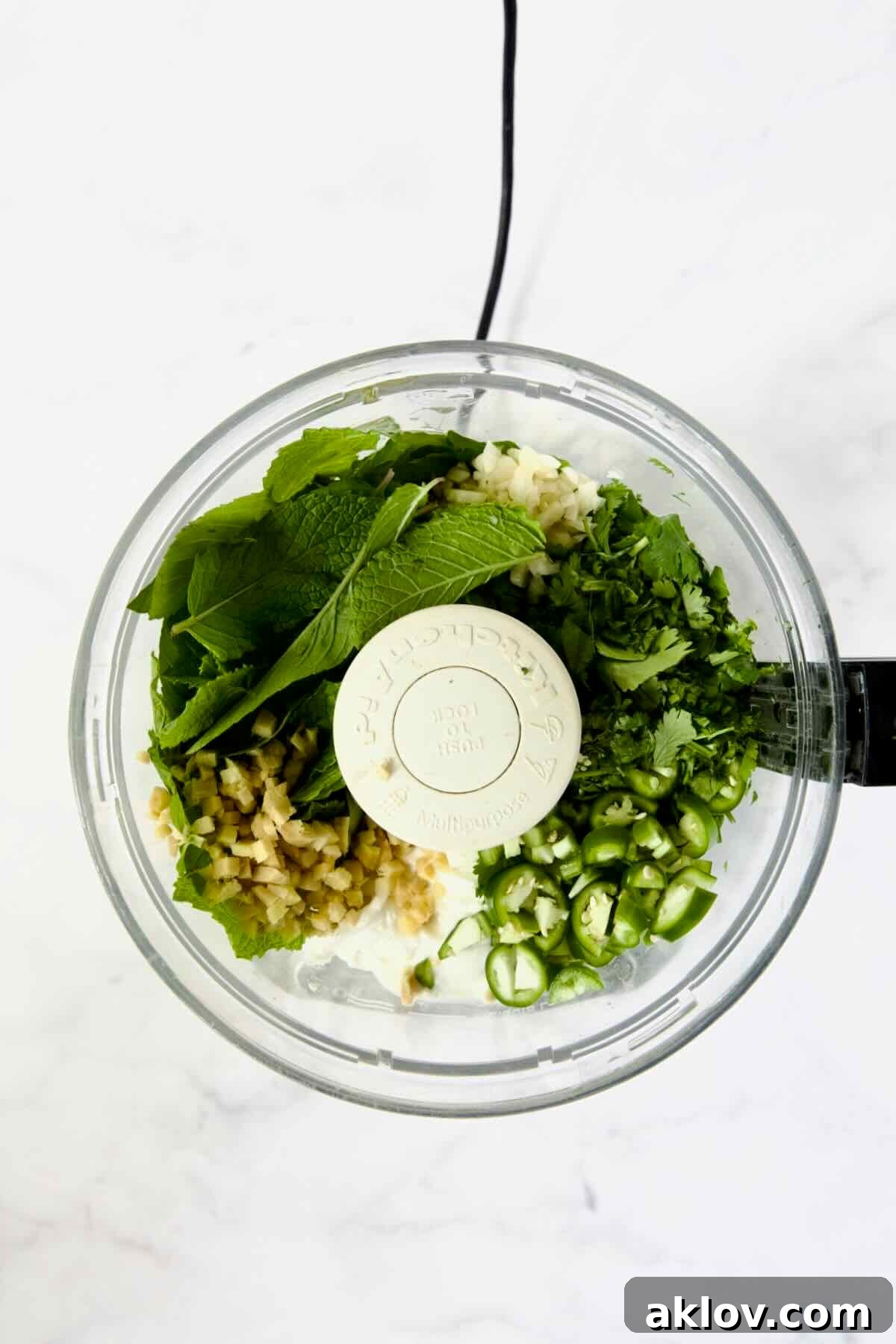 Ingredients for Cilantro Mint Chutney in food processor before being pureed.