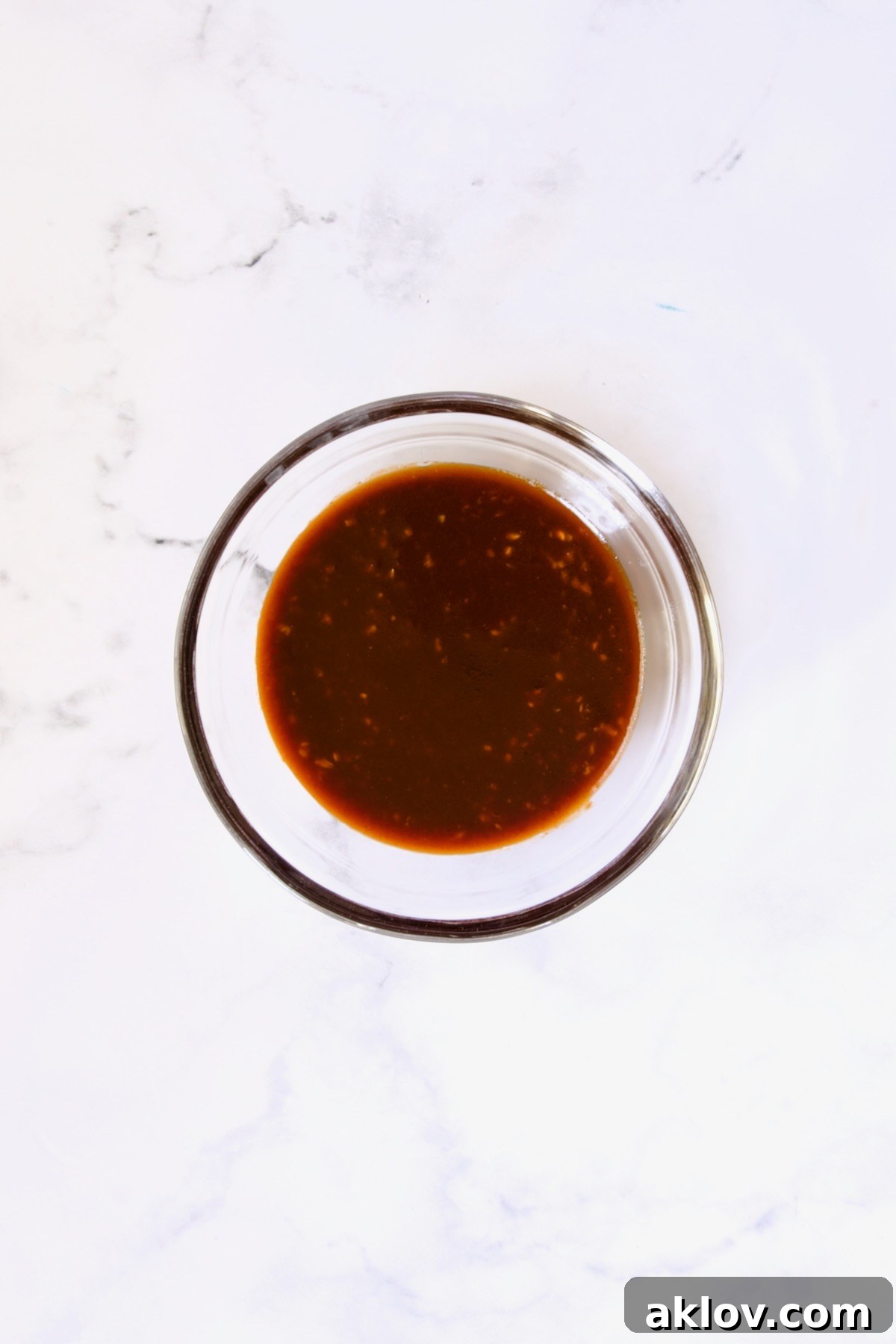 Sauce for eggplant in glass bowl.
