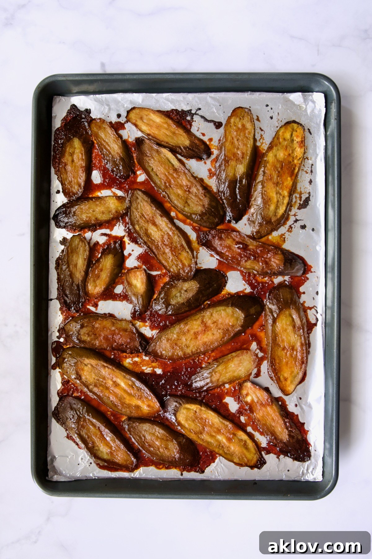 Broiled Gochujang Eggplant on aluminum foil-lined rimmed sheet pan.
