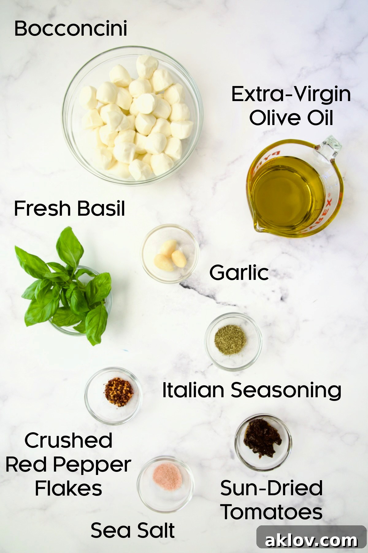 Ingredients for Marinated Mozzarella Balls in glass bowls.
