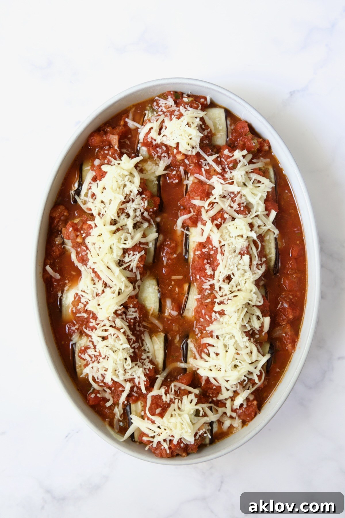 Assembled Four-Cheese Eggplant Rollatini before being baked.