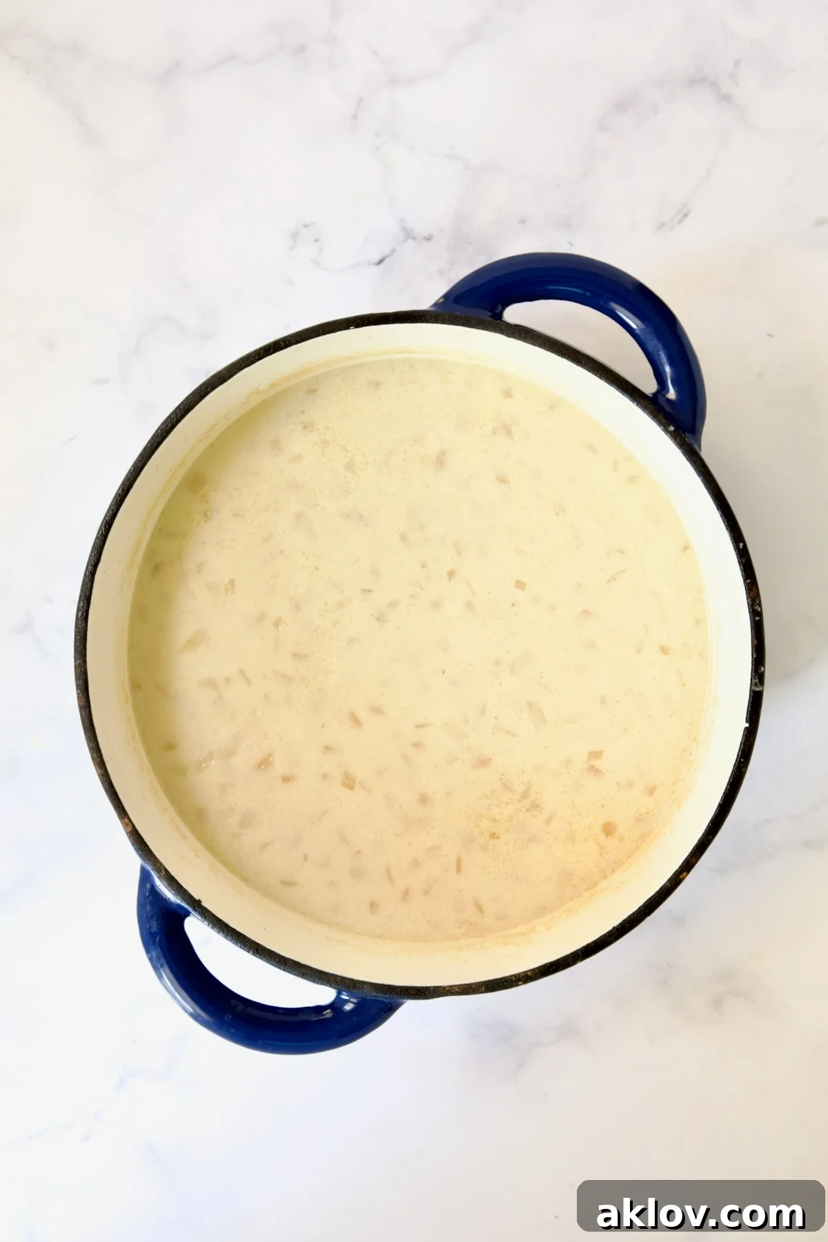 Cheddar Bacon Potato Soup with cream and thickener added.