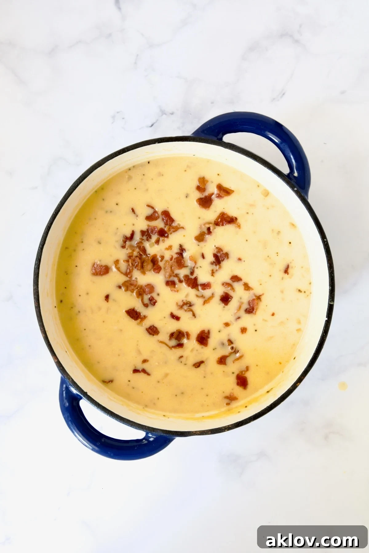 Cheddar Bacon Potato Soup with bacon sprinkled over the top.