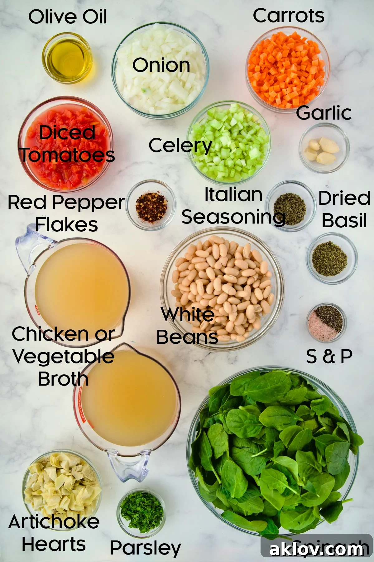 Individual glass bowls containing chopped vegetables, canned beans, and other ingredients for Vegetable Bean Soup.