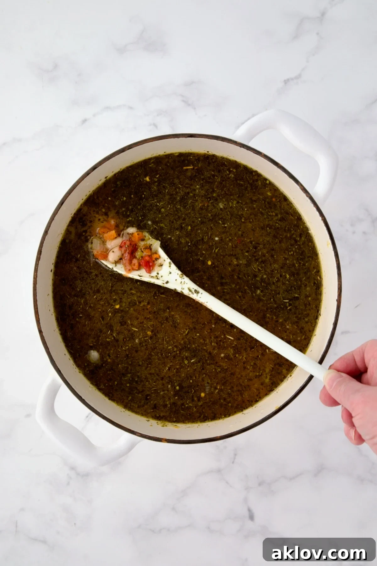 The Vegetable Bean Soup simmering gently with broth, beans, tomatoes, and artichokes.