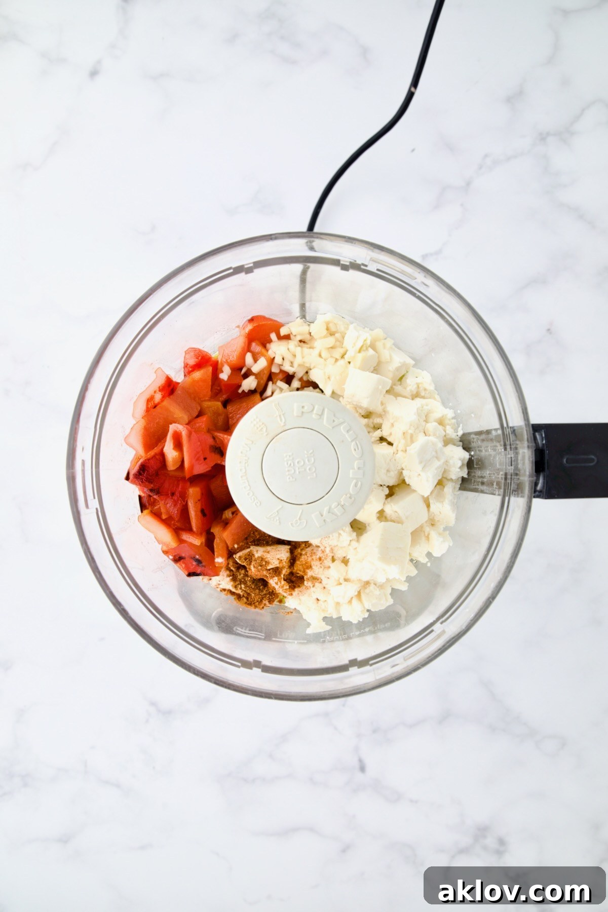 Ingredients for Spicy Feta Dip (Tirokafteri) in food processor.