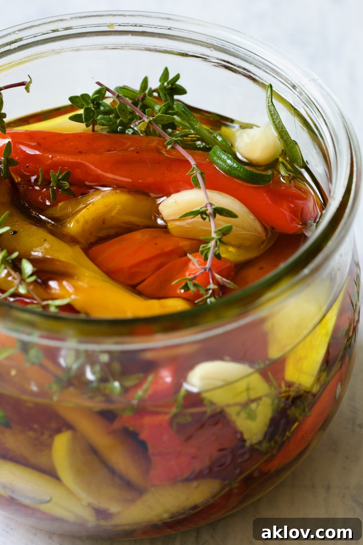 Caramelized Mini Peppers 9 Roasted Mini Peppers with garlic and herbs in glass jar.