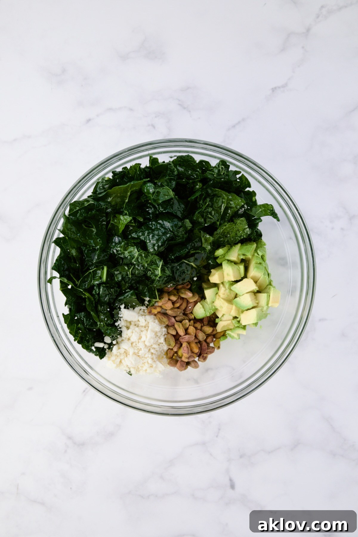 Ingredients for Tuscan Kale Salad in glass bowl.