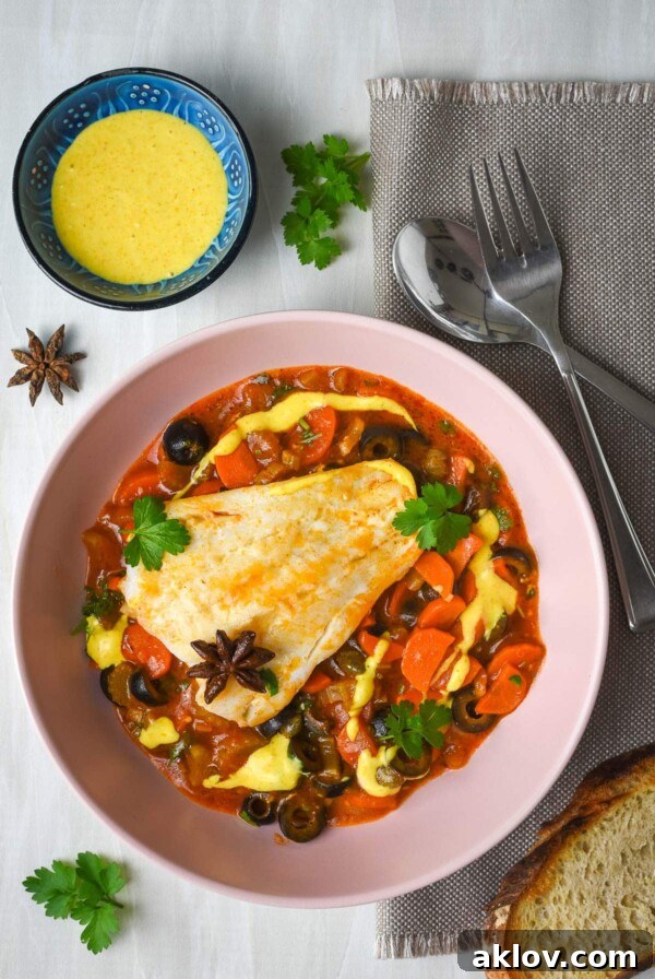 A hearty One-Pan Spanish Fish Stew, garnished with fresh herbs, served with crusty bread for a delicious meal.