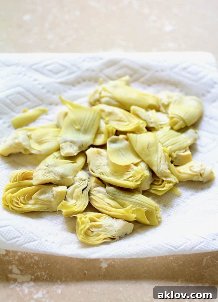 Photo of artichokes being dried on paper towel.