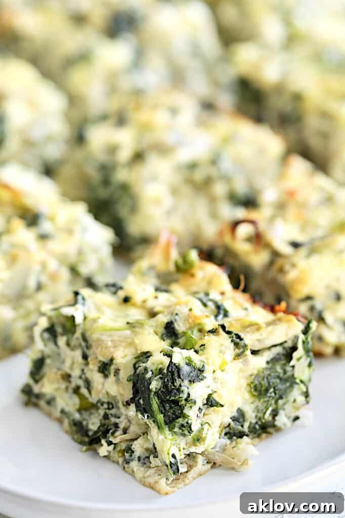 Close-up photo of one Spinach Artichoke Square.