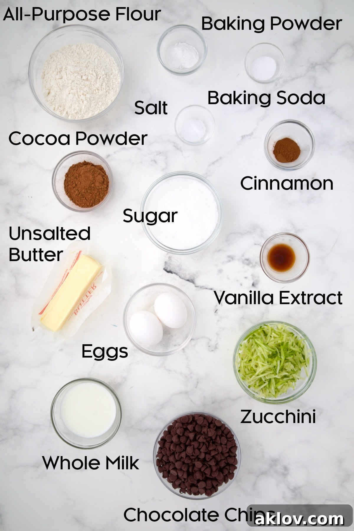 Ingredients for Chocolate and Zucchini Muffins in glass bowls.