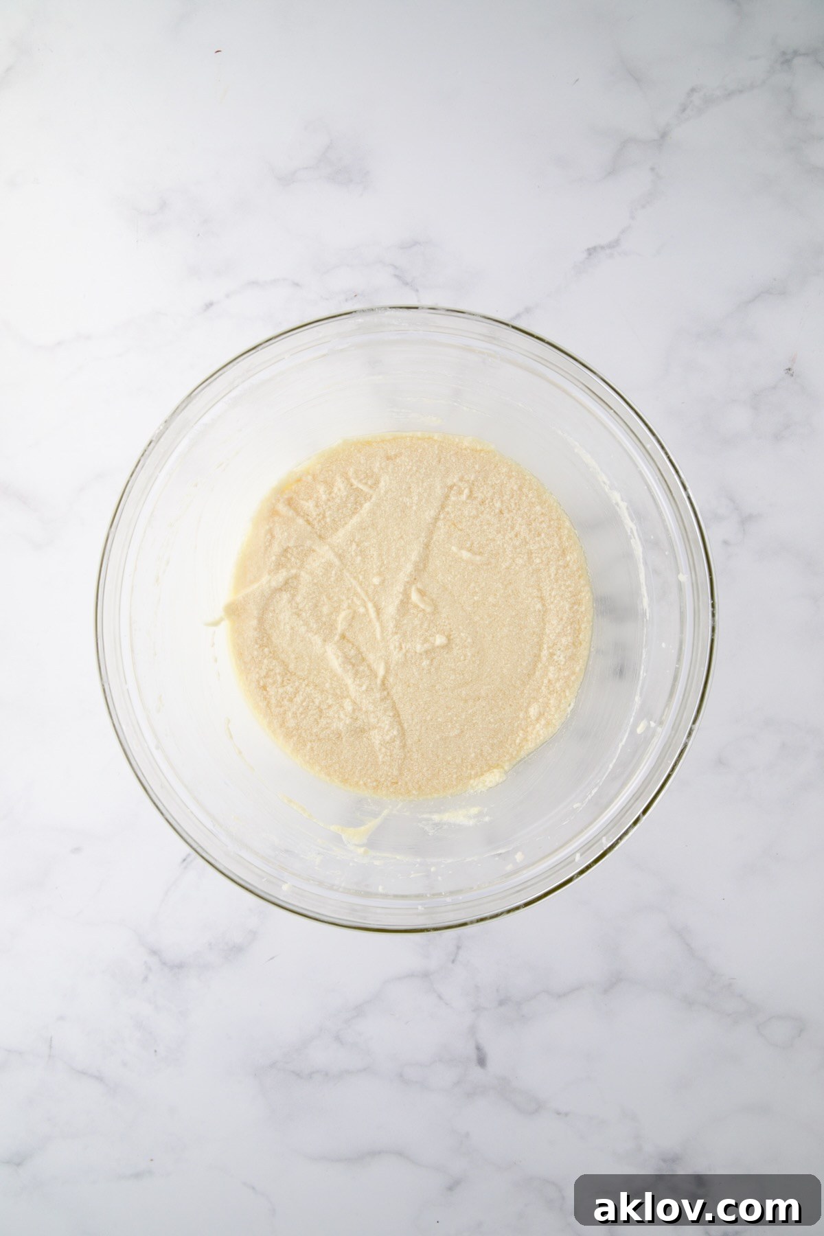 Wet ingredients for muffins in glass bowl.