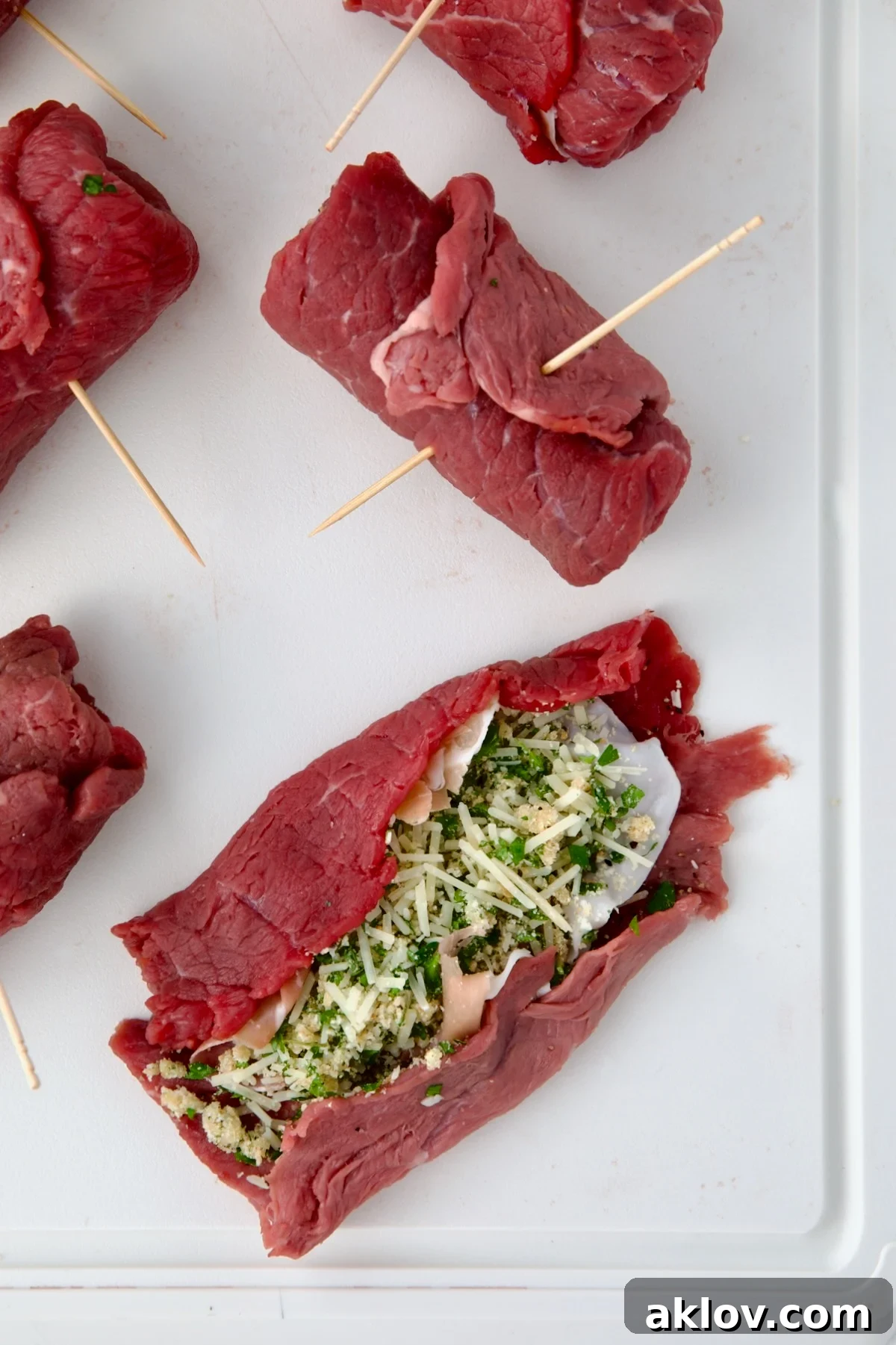 Close-up of a piece of semi-rolled Beef Braciole demonstrating how to roll them.