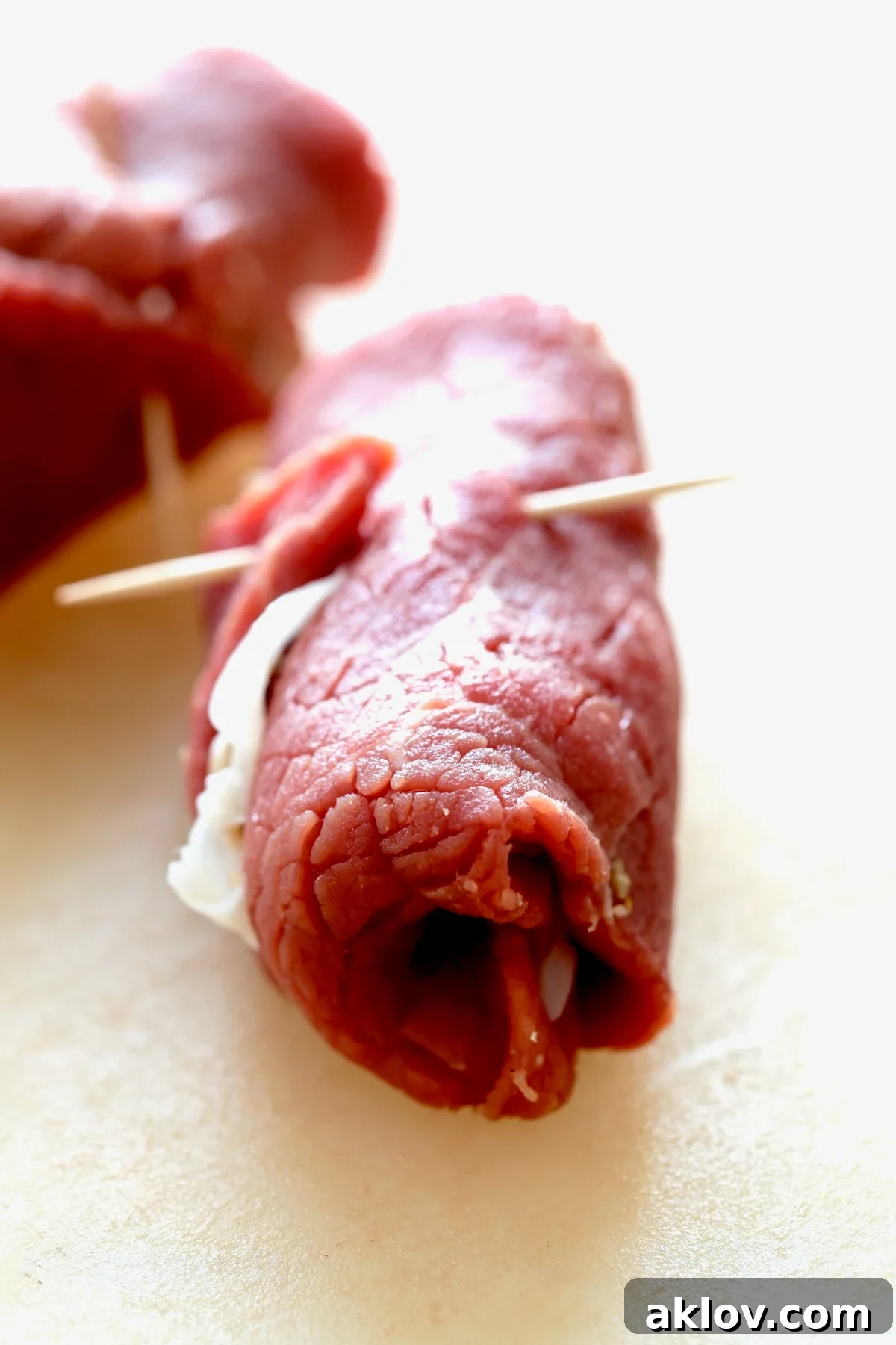 Close-up photo of one piece of Beef Braciole showing how sides are tucked in.