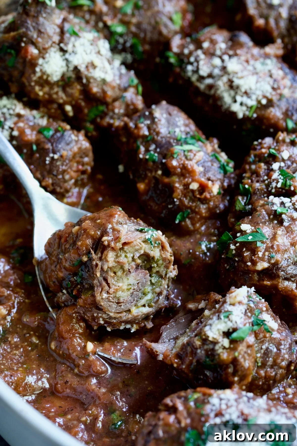 Beef Braciole cut in half to expose filling.