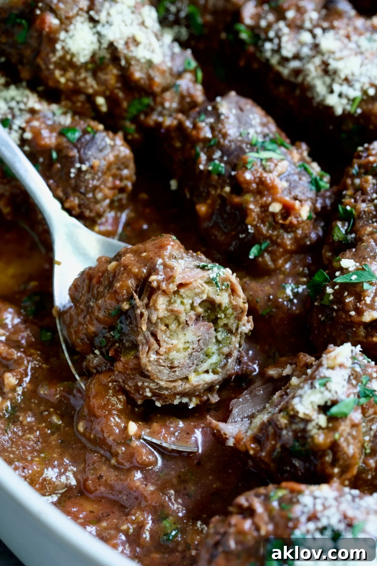 Beef Braciole cut in half to expose filling.