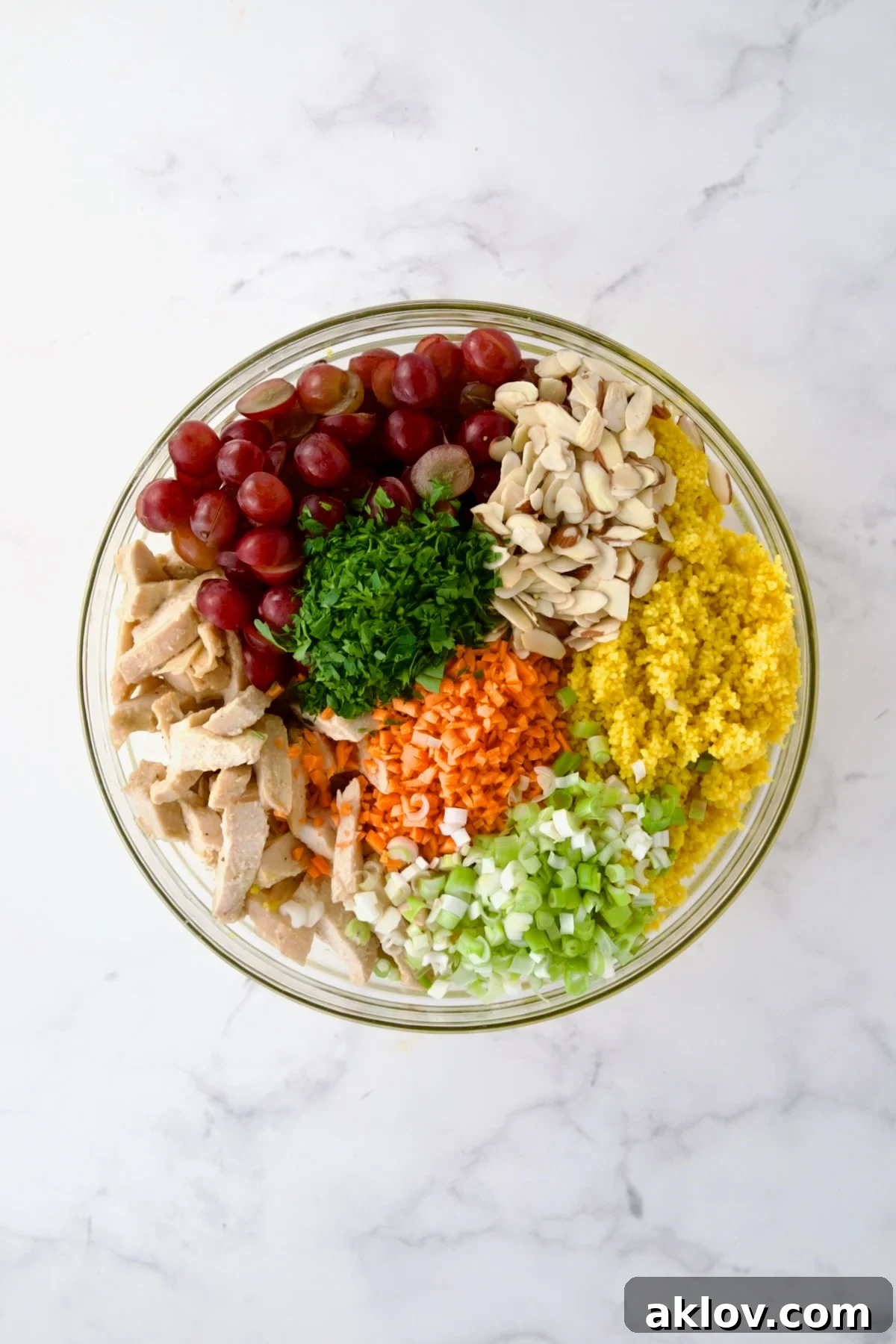 Ingredients for Chicken Couscous Salad in glass bowl before being combined.
