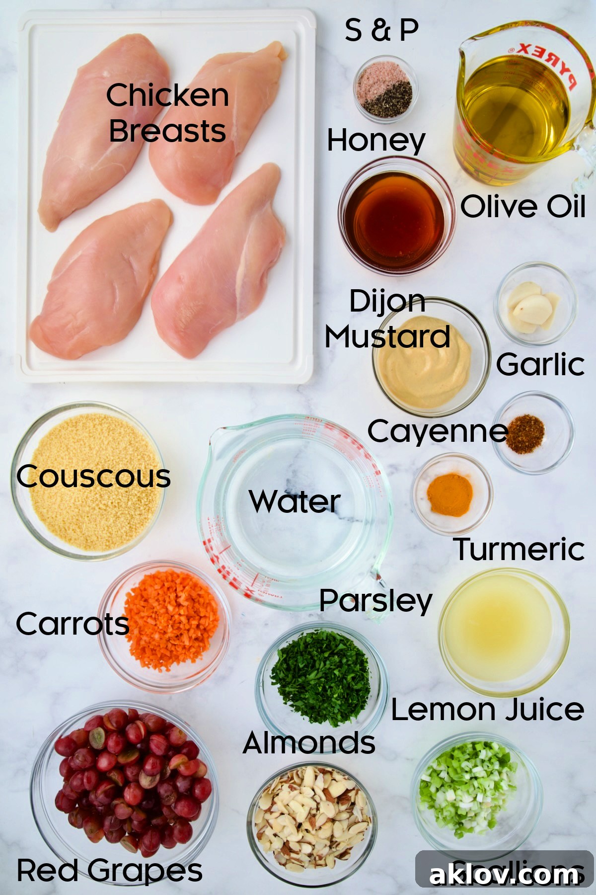 All the fresh ingredients for Chicken Couscous Salad neatly arranged in clear glass bowls, showcasing their vibrant colors and readiness for preparation.