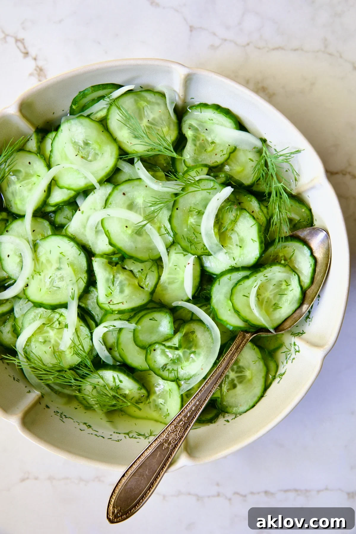 Cucumber Onion Salad presented in a beautiful serving dish.