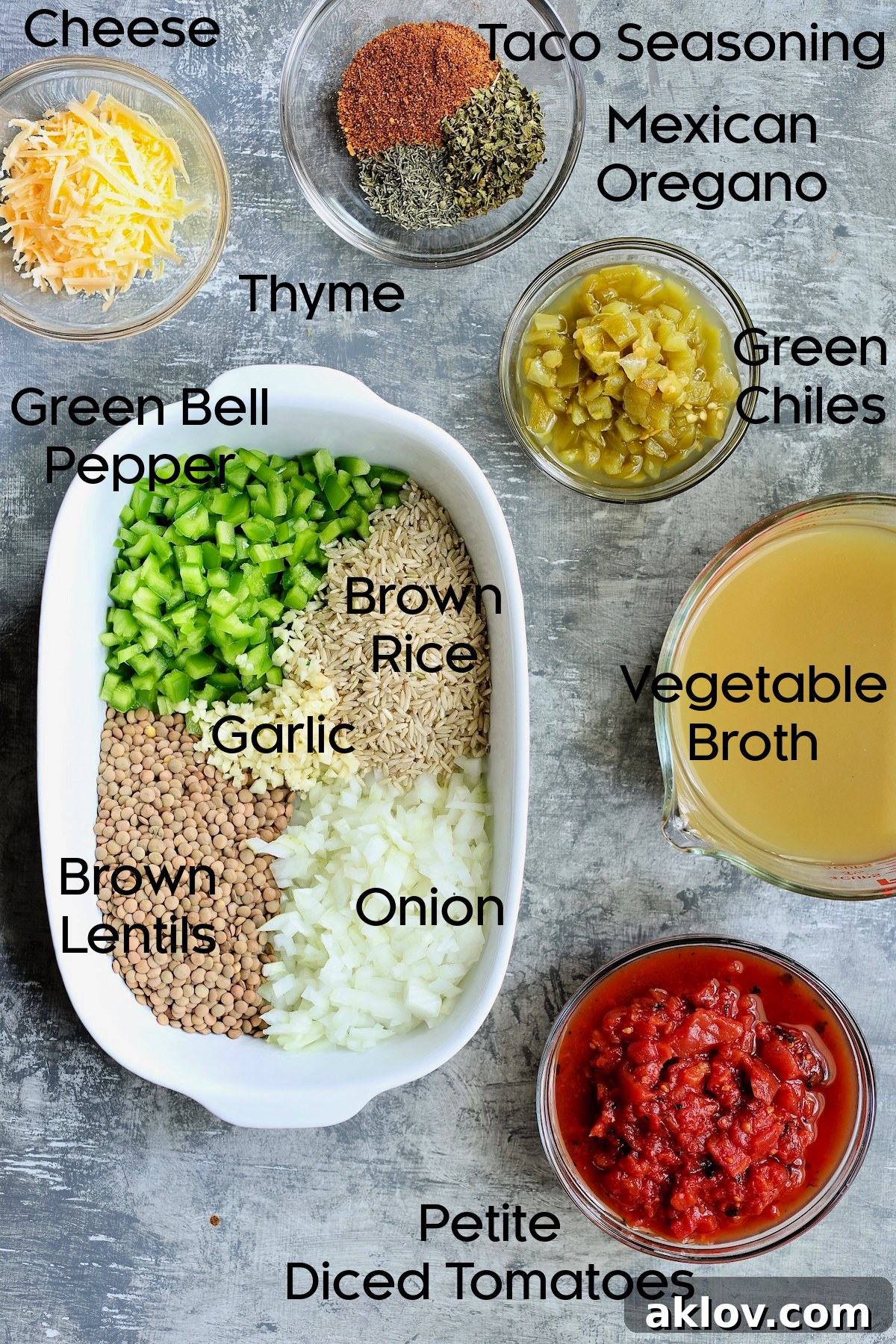 An array of fresh and pantry ingredients for Southwestern Lentil and Brown Rice Bake, neatly arranged in glass bowls on a kitchen counter.