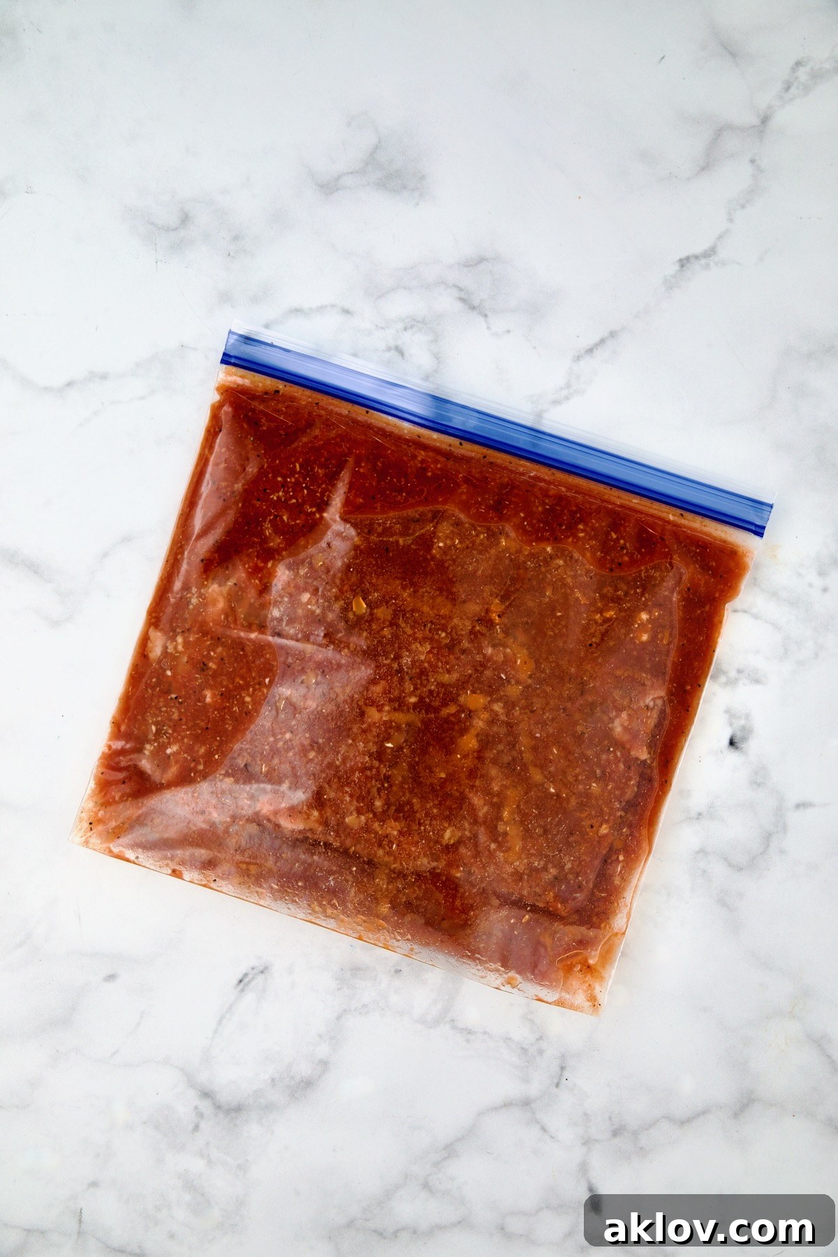 Bloody Mary marinade and skirt steak in gallon-size zipper-top bag.