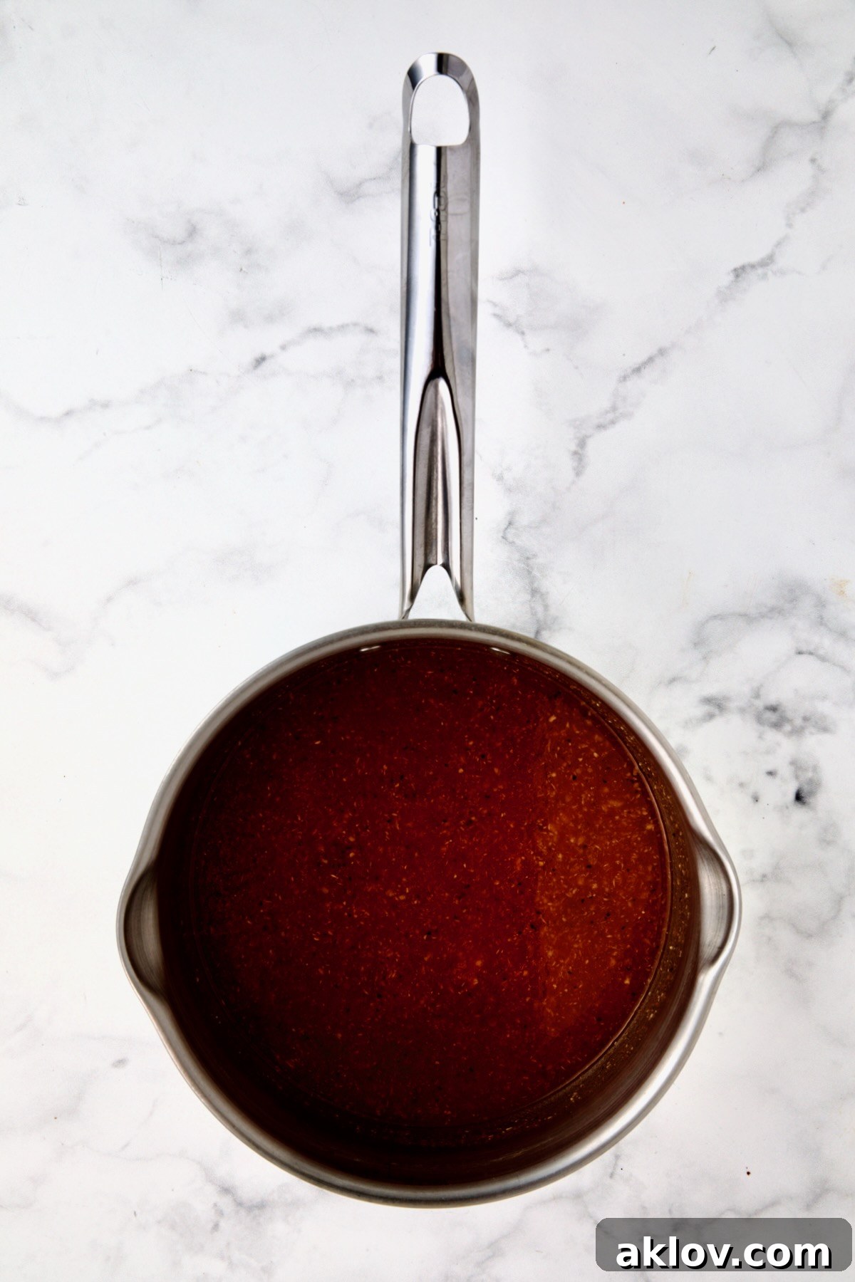 Bloody Mary marinade in stainless steel saucepan before being boiled.