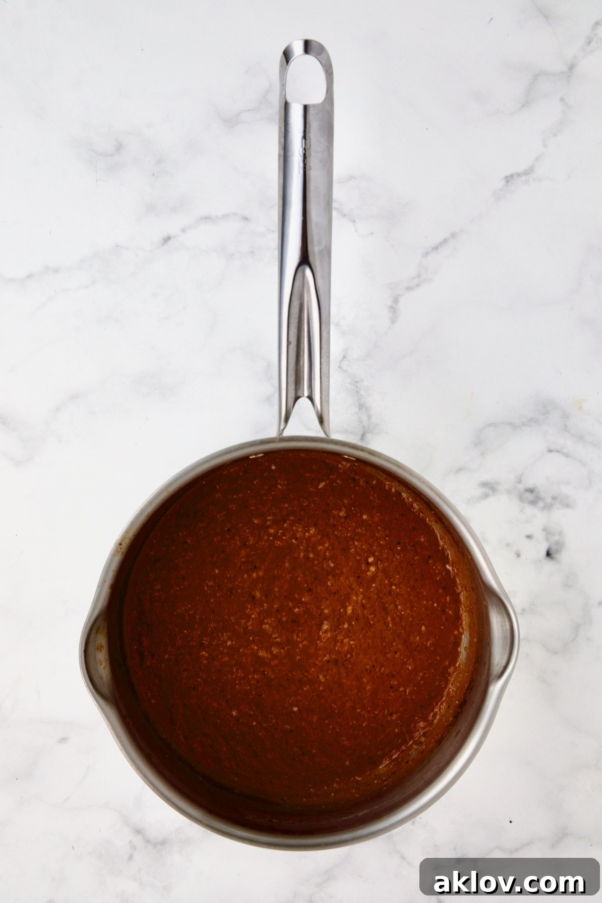 Bloody Mary marinade in stainless steel saucepan after being boiled.