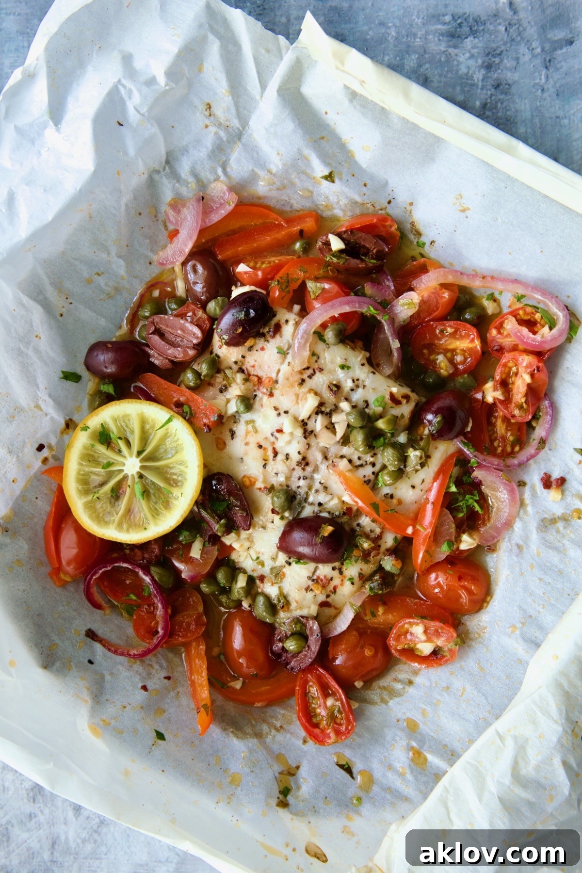 Flavorful Mediterranean Fish Parcels 14 Baked Mediterranean Fish en Papillote on parchment paper.