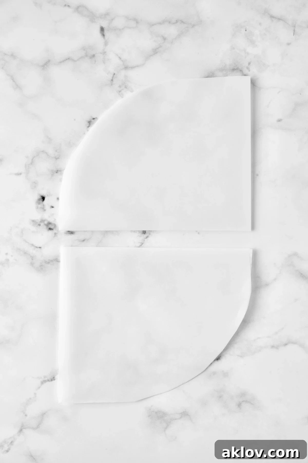 Flavorful Mediterranean Fish Parcels 6 Two folded pieces of parchment paper.
