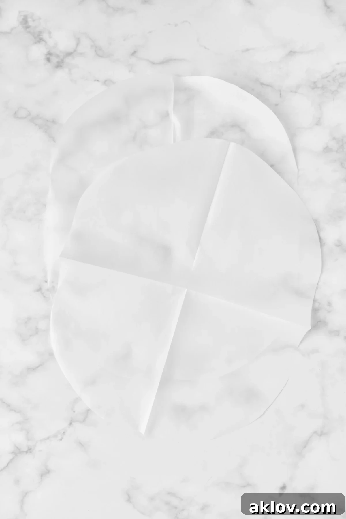 Flavorful Mediterranean Fish Parcels 7 Two pieces of parchment paper cut into large ovals.