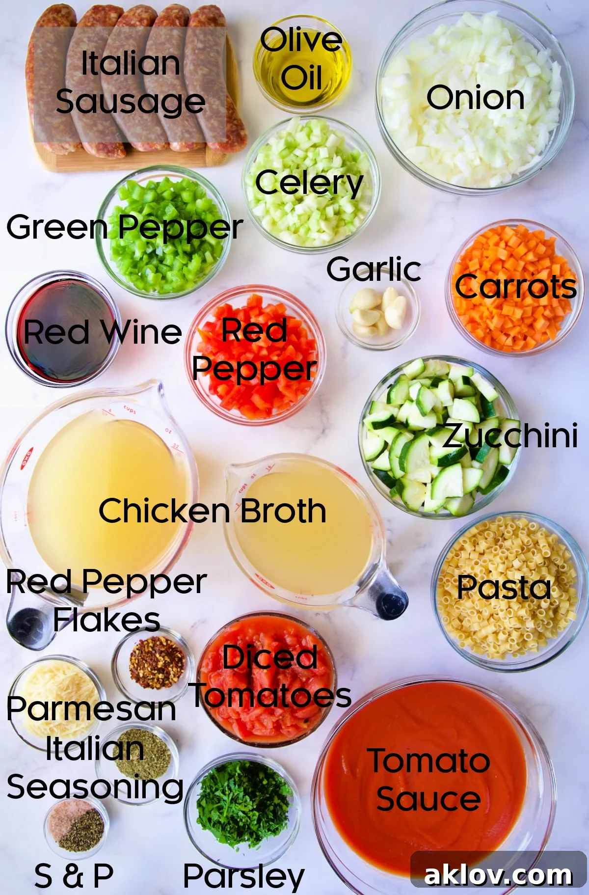 Various ingredients for Italian Sausage Soup laid out in glass bowls on a white background.