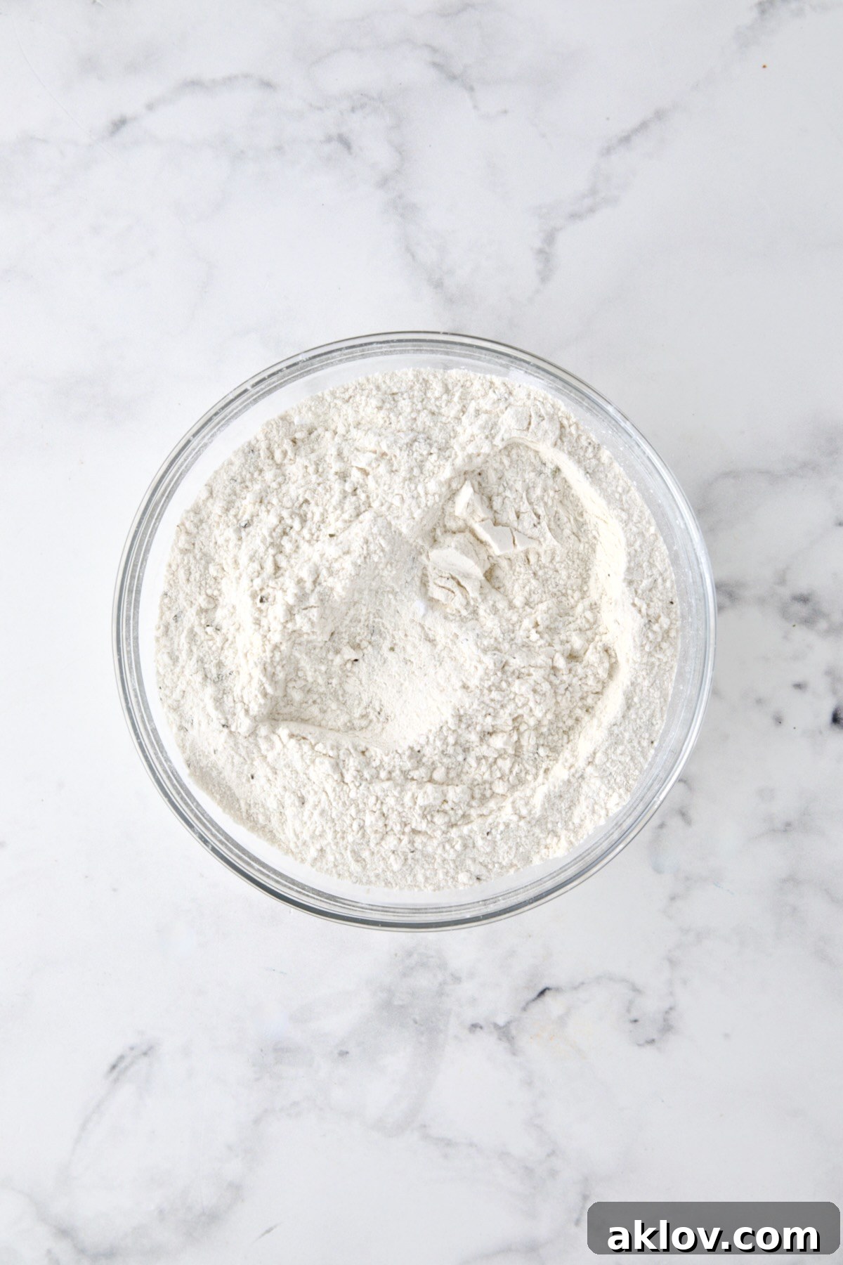 Dry ingredients for bread in glass bowl.