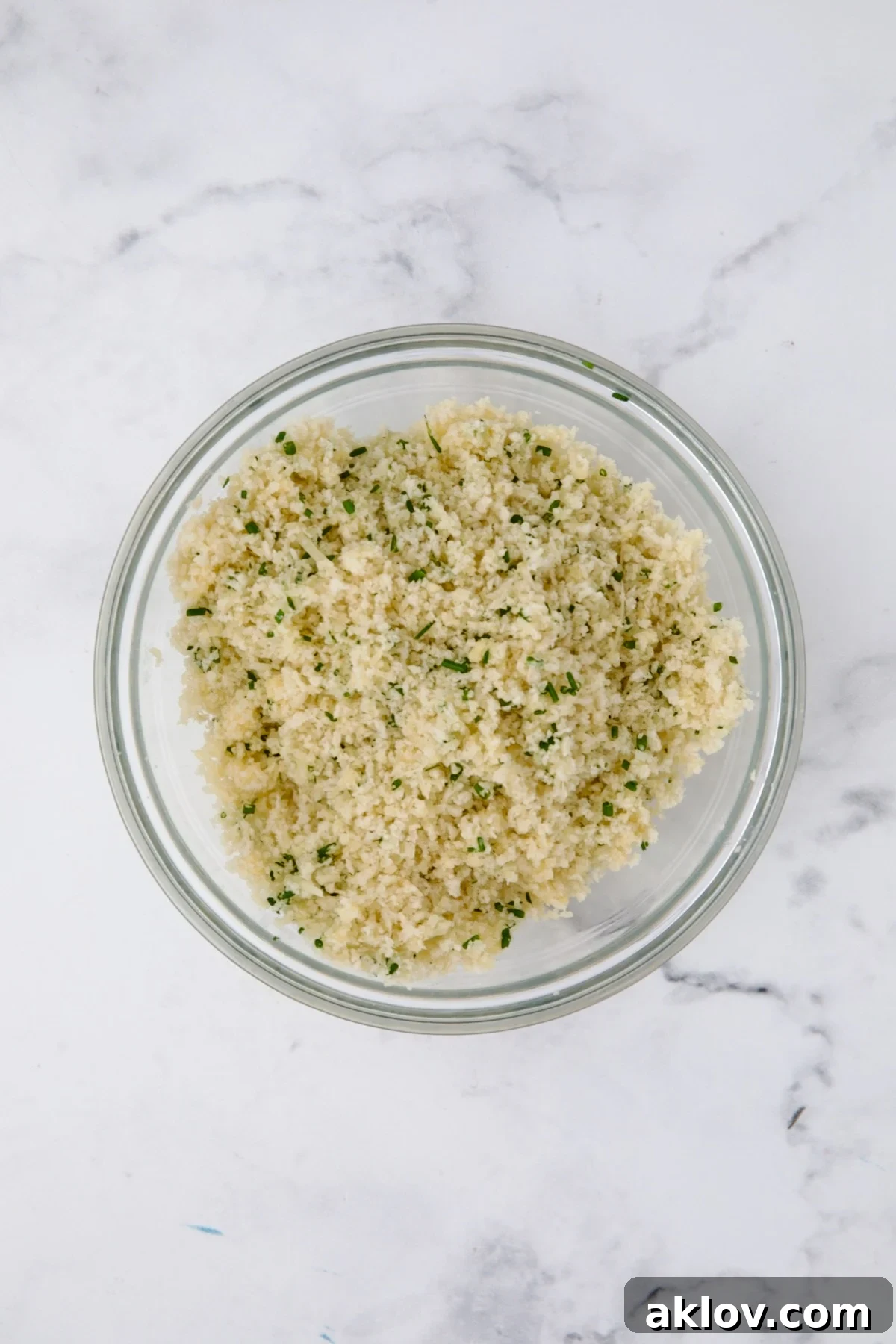 Parmesan and panko topping in glass bowl.