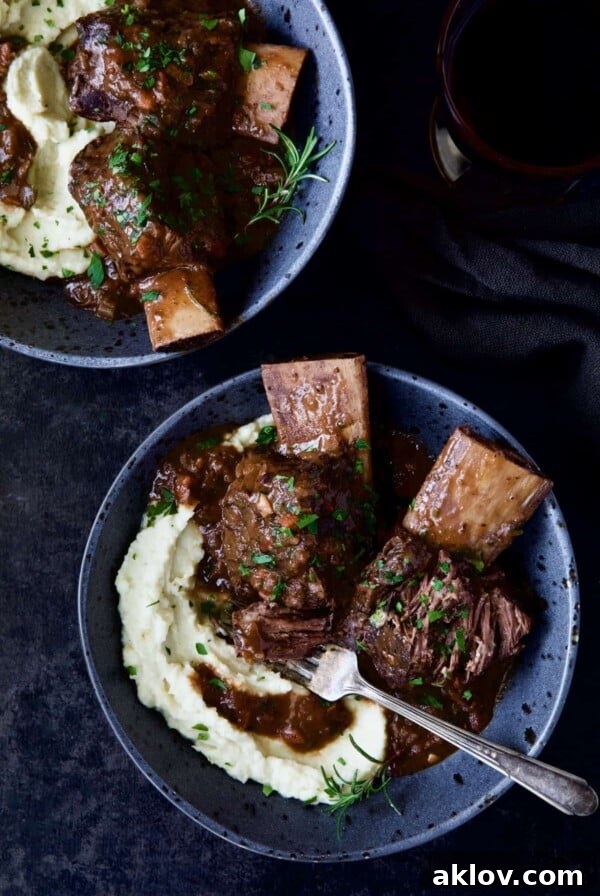 Two bowls of Braised Beef Short Ribs with Cauliflower Leek Puree.