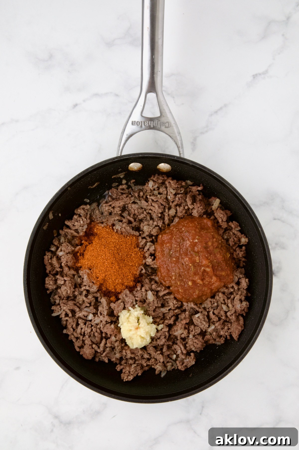 Mini Pepper Taco Poppers 7 Cooked ground beef in nonstick skillet with taco seasoning and garlic added.