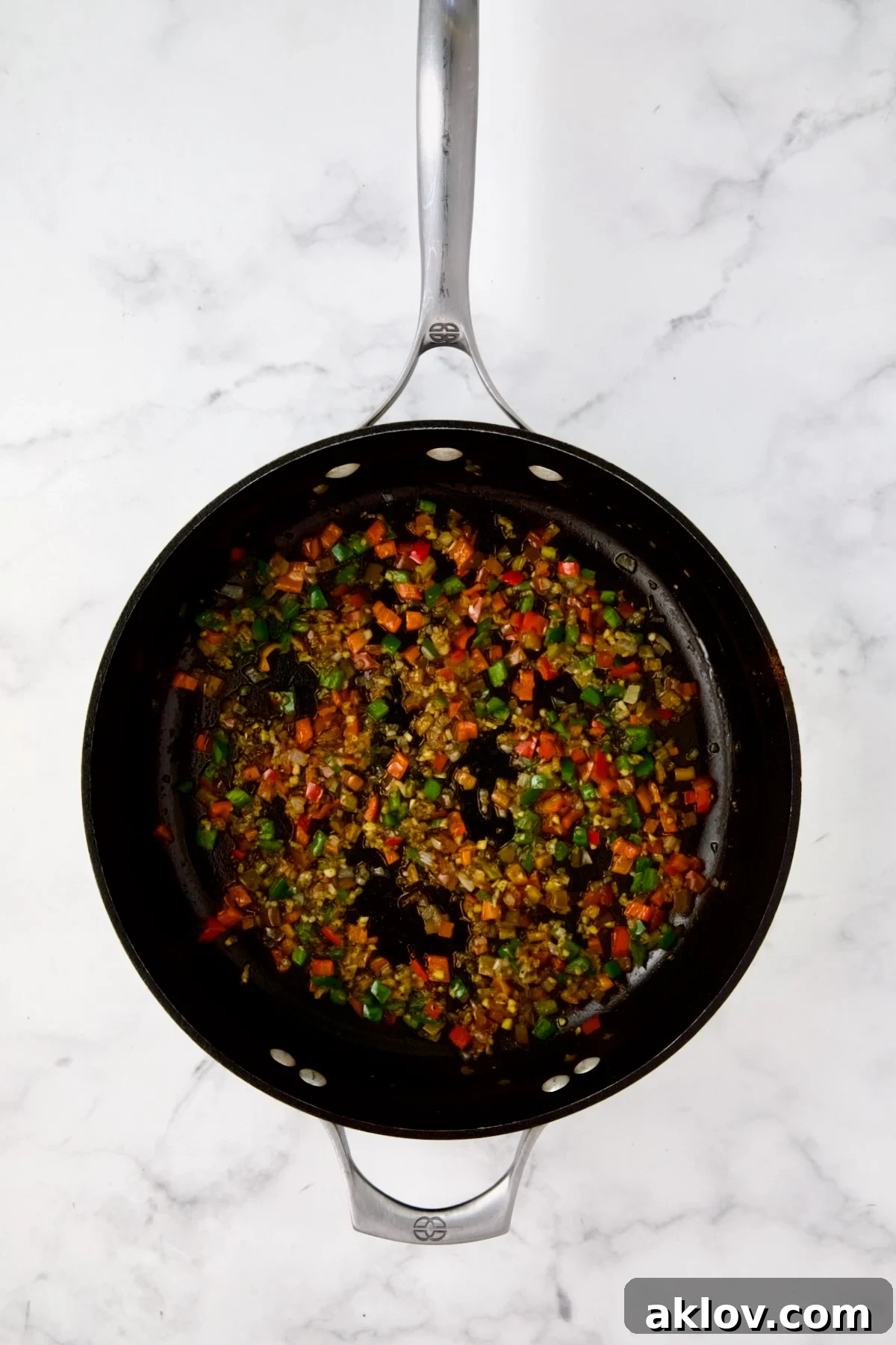 Cooked shallots, red bell pepper and jalapeno in nonstick skillet.
