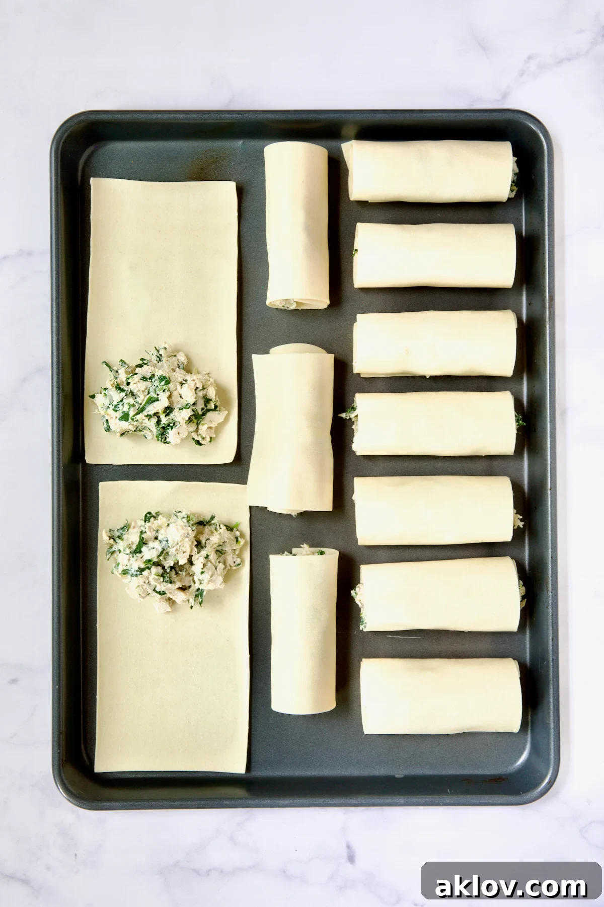 Photo demonstrating how to place filling on softened flat lasagna sheets.