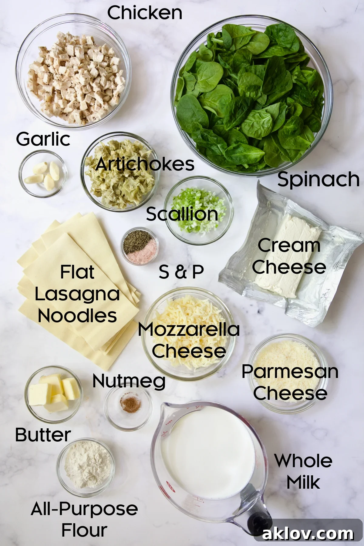 Ingredients for Cannelloni with Chicken, Spinach and Artichokes in glass bowls.