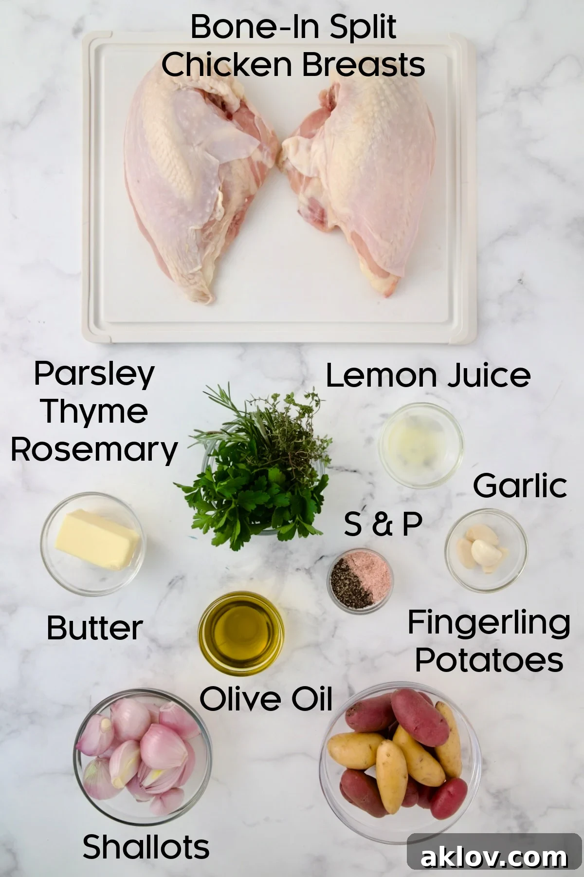Ingredients for Roast Split Chicken Breasts with Potatoes and Shallots with chicken on a white plastic cutting board and the rest in glass bowls.
