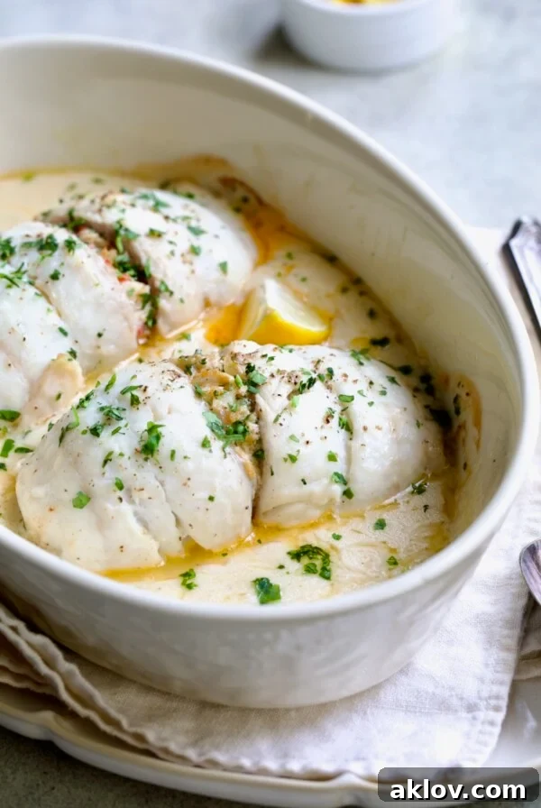 Two servings of Crab-Stuffed Flounder in oval baking dish.