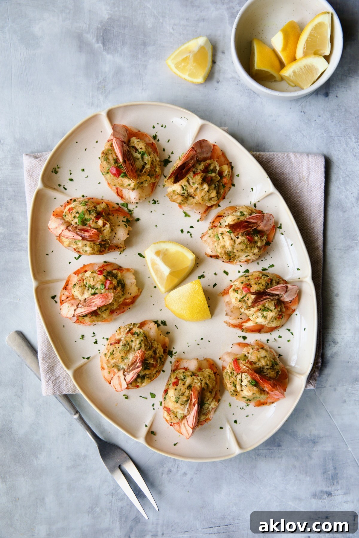 A stunning close-up of Crab-Stuffed Shrimp, garnished with fresh parsley and lemon, showcasing the delicious filling.