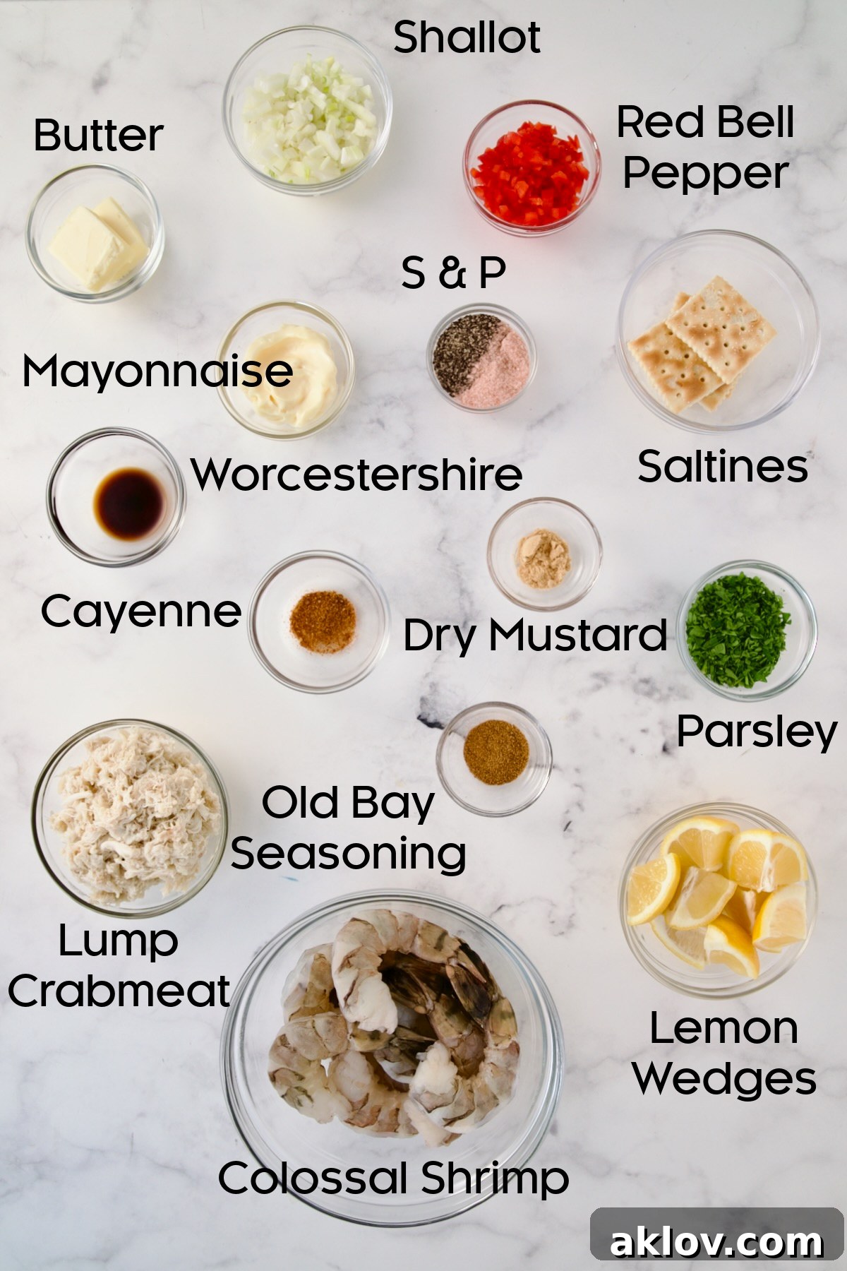 Various ingredients for Crab-Stuffed Shrimp, neatly arranged in glass bowls on a kitchen counter, awaiting preparation.