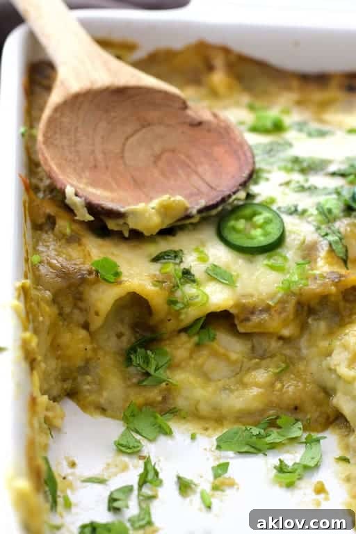 Close-up photo showing interior of enchiladas after removing some from the pan.