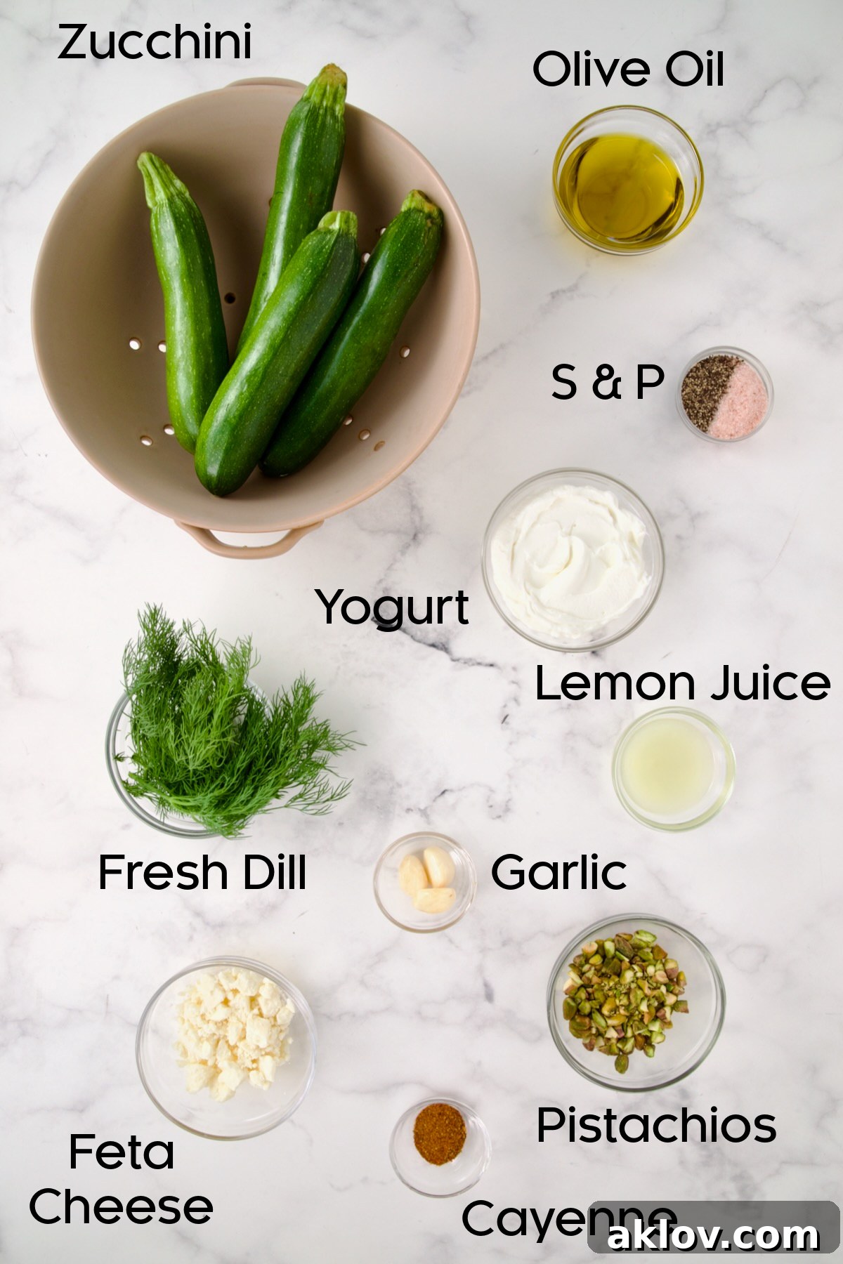 Ingredients for Mediterranean Grilled Zucchini with Dill Yogurt and Feta in glass bowls.