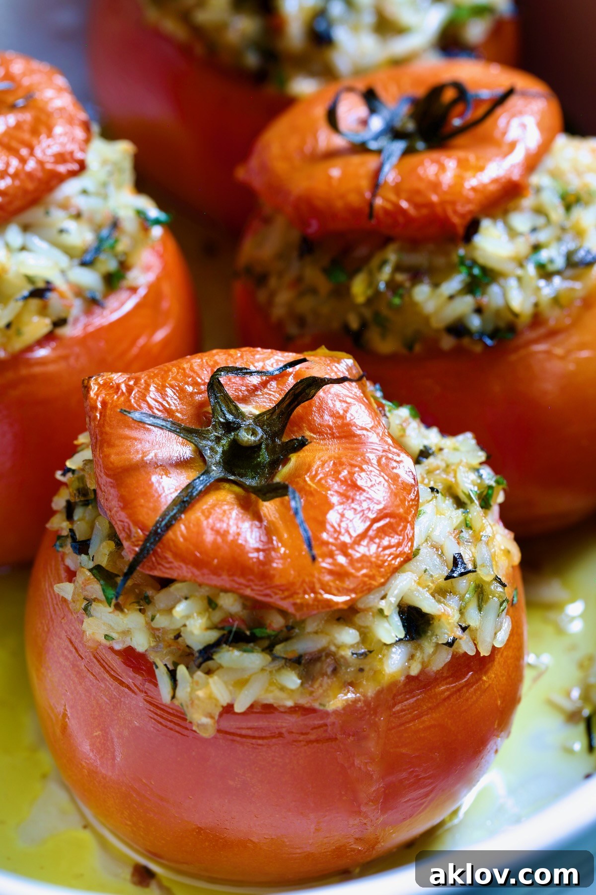 Close-up of a Cheesy Rice Stuffed Tomato, showcasing the rich filling.